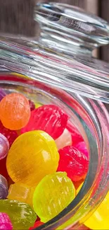 Colorful candies in a glass jar with vibrant hues.