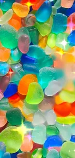 Colorful sea glass pieces forming a vibrant, candy-like wallpaper pattern.