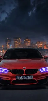 Red sports car with glowing lights in a vibrant city nightscape.