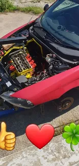 Vibrant red car with exposed engine and emojis.