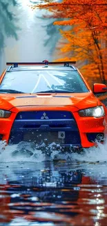 Vibrant orange car driving through an autumn forest with water reflections.