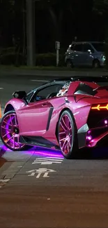 A vibrant sports car with neon lights on a city street at night.