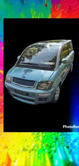 Colorful car wallpaper with blue mini vehicle on abstract rainbow background.