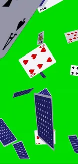Playing cards cascade over bright green background.