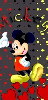 Colorful cartoon mouse wallpaper with hearts and dots on dark background.