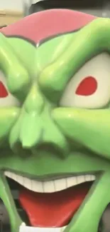 Green cartoon villain face with red eyes.