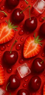 Cherries and strawberries with ice on a red background.
