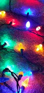 Colorful Christmas lights on dark background wallpaper.