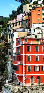 Colorful Cinque Terre village with red buildings.