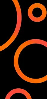 Vibrant mobile wallpaper with orange circles on black.