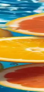 Floating citrus slices on blue water wallpaper.