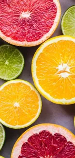 A vibrant wallpaper of sliced citrus fruits including oranges, limes, and grapefruits.