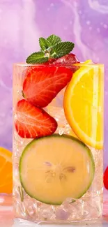 Glass of citrus drink with strawberries and lemons against a purple background.