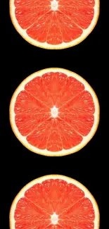 Grapefruit slices against a black background for a vibrant mobile wallpaper.