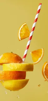 A colorful citrus fruit and straw wallpaper on a yellow backdrop.