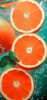 Vibrant orange slices in bubbly water wallpaper.