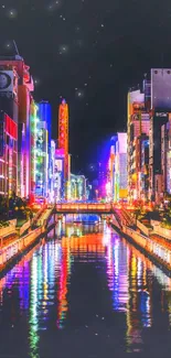 Vibrant city lights reflecting in a canal at night, perfect for mobile wallpaper.