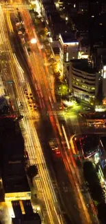 Aerial view of vibrant city lights at night from above.