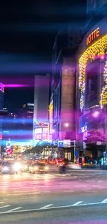 Vibrant city night scene with colorful lights and urban architecture.