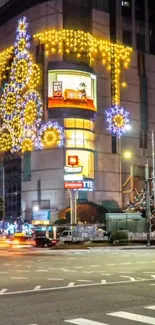 Festive city lights showcase on urban building at night.