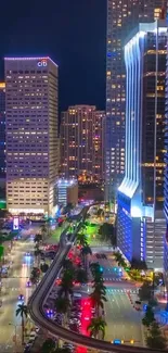 Vibrant city night skyline with illuminated skyscrapers and streets.