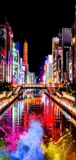 Colorful city nightscape with neon lights reflecting on a river at night.