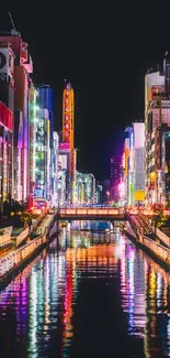 Colorful neon cityscape with river reflections at night.