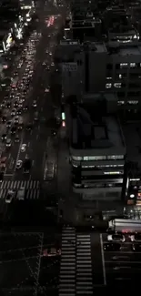 Nighttime city street view with traffic and skyscrapers in dark tones.