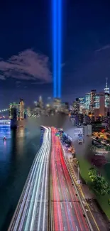 Nighttime cityscape with vibrant lights and beams illuminating the skyline.