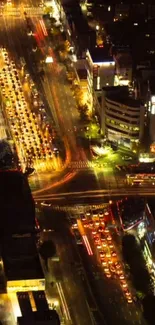 A vibrant city street illuminated by colorful night lights.