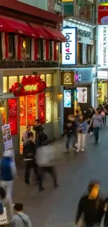 Vibrant city street with glowing signs and bustling night life.