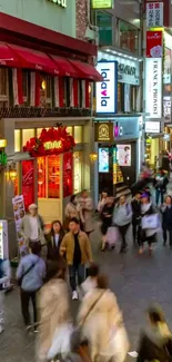 Vibrant city street scene with bustling crowds and colorful shop signs.