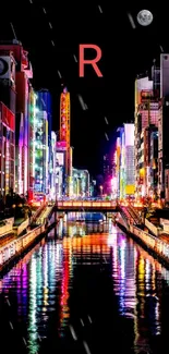 Colorful cityscape at night with vibrant lights reflecting on the river.