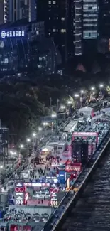 Vibrant urban night view along illuminated river.