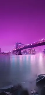 Purple lit city bridge with serene water reflection.