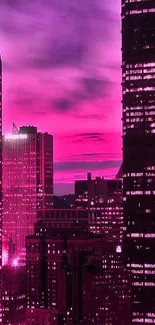 Stunning pink cityscape wallpaper with illuminated buildings at dusk.