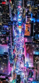 Vibrant aerial cityscape at night with colorful lights.