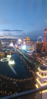 Vibrant cityscape at night with iconic landmarks and dazzling lights.