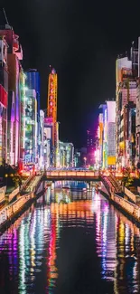 Colorful neon cityscape with river reflections at night.