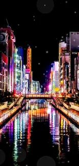 Vibrant night cityscape with neon lights reflecting in a canal.