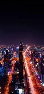 Vibrant cityscape view at night with colorful lights illuminating the skyline.