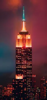 Vibrant New York City night skyline with glowing skyscraper under crimson sky.