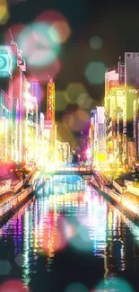 Vibrant cityscape at night with colorful lights reflecting on water.