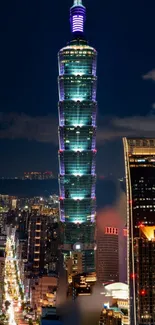 Stunning Taipei 101 illuminated at night against vibrant cityscape.