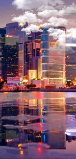 City skyline with colorful reflections at dusk.