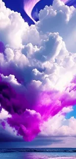 Purple clouds over ocean with vibrant sky.