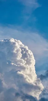 Blue sky with billowing white clouds forming a serene and picturesque scene.