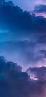 Vibrant mobile wallpaper featuring blue and purple clouds.