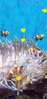 Colorful clownfish swim in vibrant ocean aquarium.