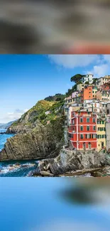 Colorful houses on a coastal cliff by the blue sea.